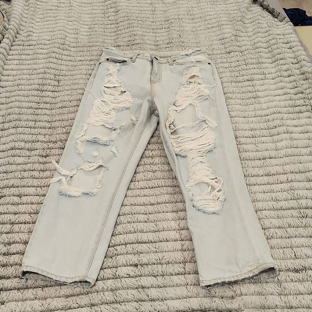 Overly distressed high waist Carmar light wash jeans size 27!